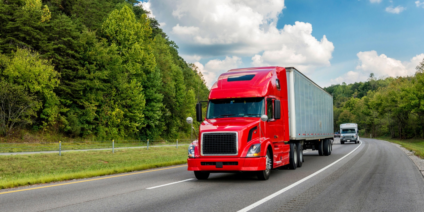 Full Truckload FTL shipping service offered by Smart KLip Logistics with a large truck on a highway